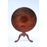 An 18th century mahogany tripod table, the circular one-piece tilt top on ‘birdcage’ support, &