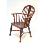 A 19th century yew wood & elm Windsor elbow chair with pierced splat to the hooped spindle back,