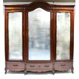 A LATE 19th century CONTINENTAL MAHOGANY WARDROBE with arched cornice, enclosed by three full-length