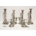 A matched set of four 19th century candlesticks with round tapered columns & foliate borders, 11¼”