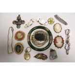 A green jade hinged bangle; a pair of mother-of-pearl buckles; four cameo brooches; two
