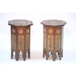 A pair of middle-eastern inlaid octagonal occasional tables; 13½" wide x 21" high. (w.a.f.)