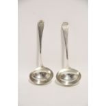 A pair of George III Old English sauce ladles with oval bowls; London 1798, by W. S. (3oz)