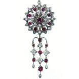 A RUBY & DIAMOND BROOCH/PENDANT of circular open design, set centre ruby within alternating