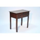 An 18th century oak side table fitted two short & one long drawer with brass drop handles, on square