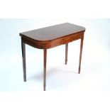 A George III style figured mahogany tea table with crossbanded & inlaid fold-over top, having rouned