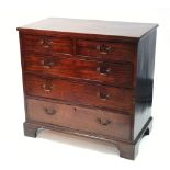 An early 19th century mahogany chest fitted two short & three long graduated drawers with brass