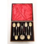 A set of six late Victorian silver-gilt apostle coffee spoons with shell bowls & writhen stems;