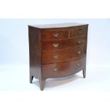 An early 19th century mahogany bow-front chest fitted two short & three long graduated oak-lined