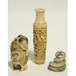 A Japanese carved ivory netsuke in the form of a coiled snake, signed, 1" high; a Japanese carved