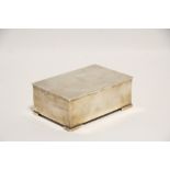 A George V rectangular cigarette box, the solid hinged lid with engraved monogram, inscription to