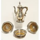 An 18th century Sheffield coffee pot of baluster shape, with domed hinged cover, scroll spout,