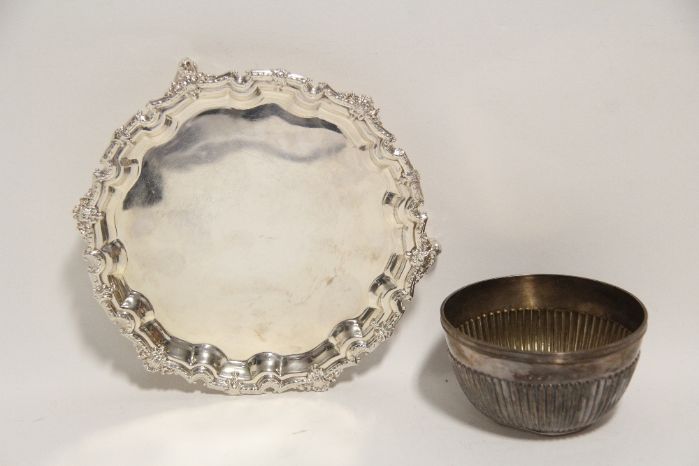 A modern card tray with raised scroll border & on three claw-&-ball feet, 6¼” diam.; Birmingham