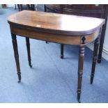 A regency mahogany & satinwood crossbanded tea table with D-shaped fold-over top, on slender ring-