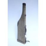 A canvas-covered & leather mounted leg of lamb gun case, 31” long.