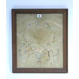 An early 19th century silk needlework picture of flowers forming a heart motif; 16½" x 14".