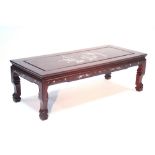 A Chinese hardwood low rectangular occasional table, matching the preceding lot; 50" x 22".