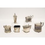 An Art Deco style three-piece condiment set, Birmingham 1931; & three mustard pots with pierced