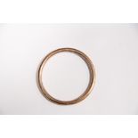 A 9ct. gold plain circular hollow bangle. (11.4 gm).