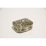 An 18th century German silver-gilt snuff box of rectangular shape with bombé sides, the hinged lid