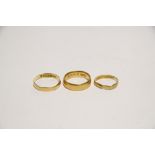 Three 22ct. gold wedding bands. (9.4 gm total).