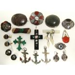 A collection of coloured hardstone jewellery including brooches, pendants, etc., in agate,