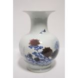 A Chinese porcelain large ovoid vase with narrow neck flared rim, the body painted with peonies in
