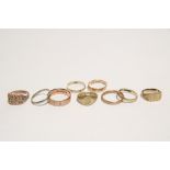 A 9ct. gold ring with "weave" design panel; two 9ct. gold signet rings; & six various 9ct. gold