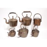 Five various copper kettles; & a cylindrical copper cooking vessel with lid.