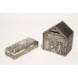 An Edwardian wooden money box in the form of a cottage, the front covered with an embossed silver