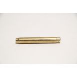 A 9ct. gold cylindrical pencil holder with push-button release to one end, 3" long; London 1931,