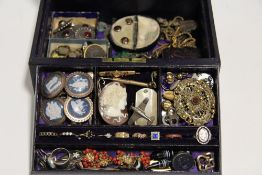 Various items of gem-set & costume jewellery, etc., contained in a purple morocco leather