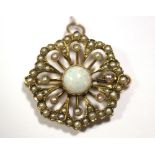 A 9ct gold eight-sided openwork brooch set centre opal within a double border of seed pearls; 1"