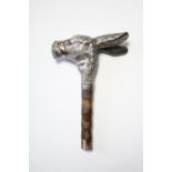 AN EDWARDIAN WALKING CANE HANDLE in the form of a bridled donkey’s head, it’s ears laid back, 3"