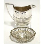 A Victorian oval semi-fluted milk jug with engraved monogram, 4" high; Sheffield 1883 (5½oz); & a