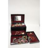 A quantity of costume jewellery contained in two jewellery boxes.