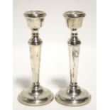 A pair of 7¼" candlesticks with round tapered columns & on circular bases; Birmingham 1971, by P. H.