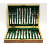 Twelve pairs of late Victorian engraved dessert knives & forks with mother-of-pearl handles, in