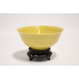 A Chinese porcelain yellow-ground deep bowl with slightly flared rim, 5½" diam.; Kangxi six-
