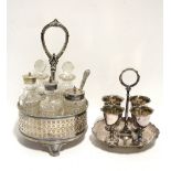 A circular cruet stand with pierced sides & centre ring handle, fitted five cut-glass cylindrical