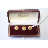 Three 18ct gold engraved circular dress studs; Birmingham 1924. (3.8gm)