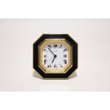 A Cartier travelling alarm clock in octagonal gilt-brass & black enamel case with easel support,