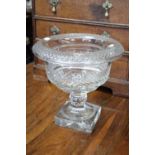 A 19th century heavy cut glass bowl with turn-over rim, on square pedestal foot; 11½" diam. x 11"