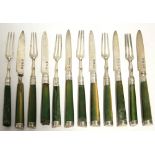 Six pairs of George III dessert knives & forks with green-stained ivory handles; Sheffield 1774,