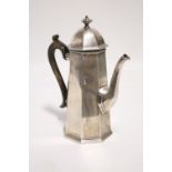 A Victorian coffee pot in the George I style, of plain octagonal tapered form, with hinged domed