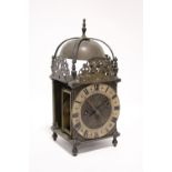 A late 19th/early 20th century brass lantern clock in the late 17th century style, the 5¾” diam.