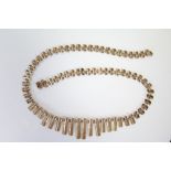 A 9ct gold necklace of textured & plain graduated links, 17" long. (12.5gm)