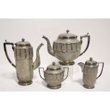 AN INDIAN FOUR-PIECE TEA & COFFEE SERVICE, each of oval cross-section with band of lobed panels to