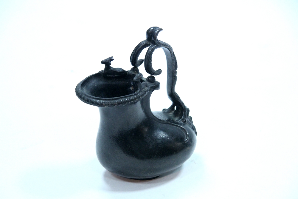 A bronze ewer in the form of a Pompeian Ascos; 7". - Image 2 of 4