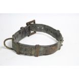 An antique brass-studded leather dog collar, 8” diam.